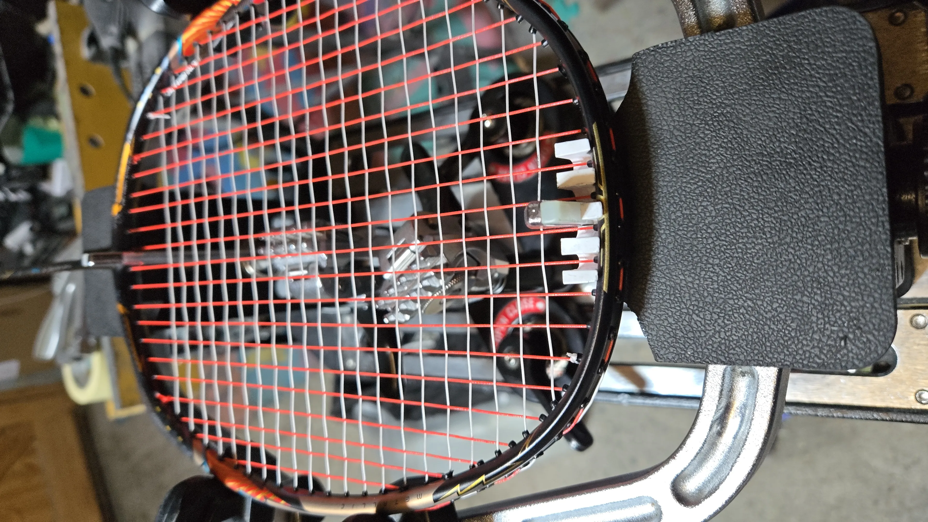 Badminton racket grommet repair before restringing