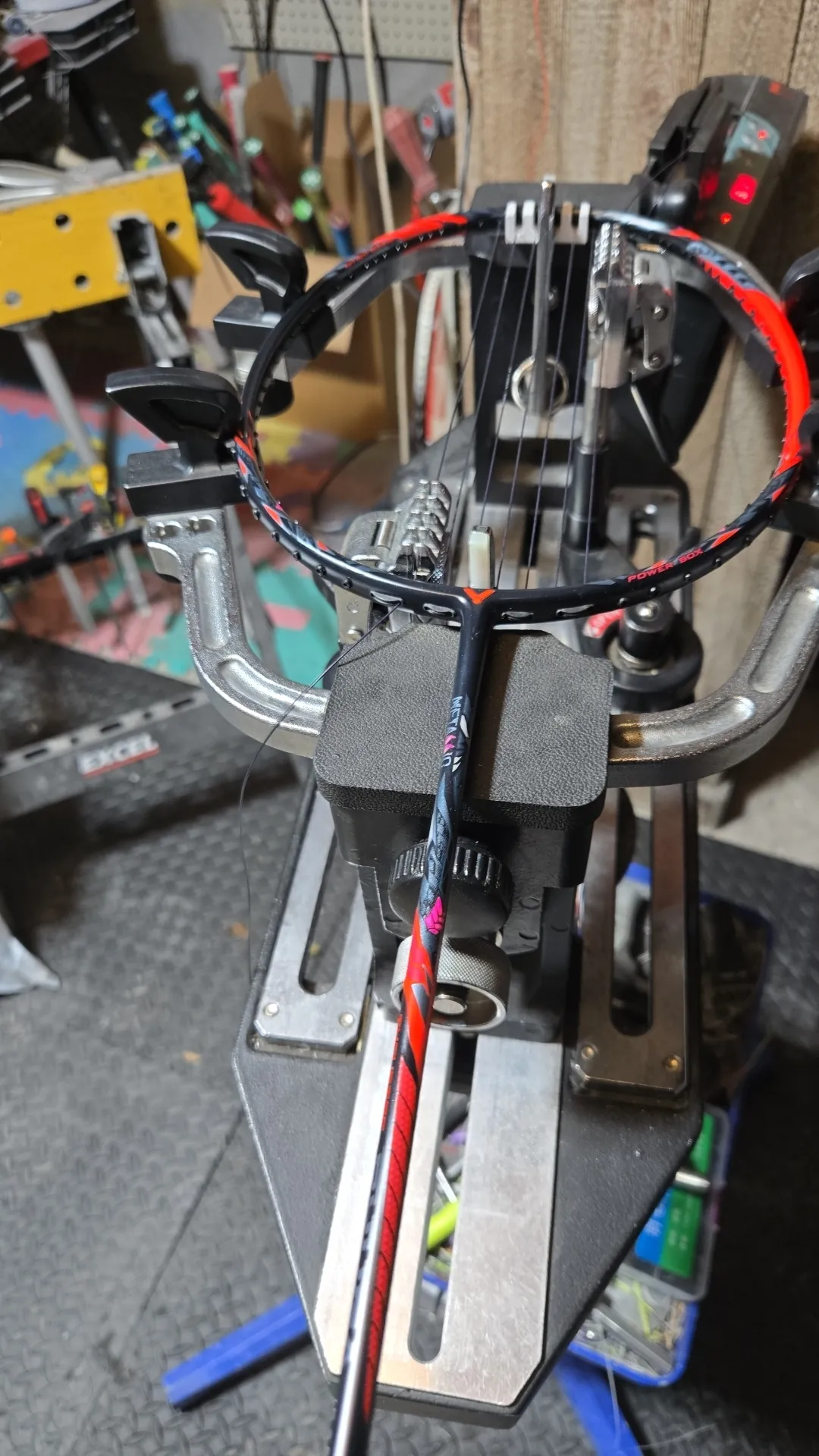 High tension badminton racket restringing in progress